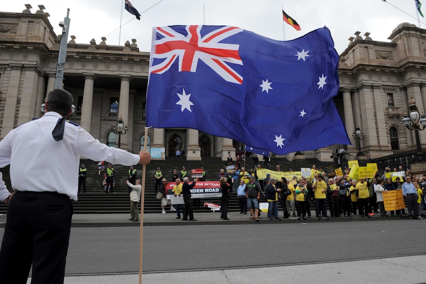 Taxi drivers protest outside Parliament house in Melbourne over Government deregulation plans for the Taxi industry