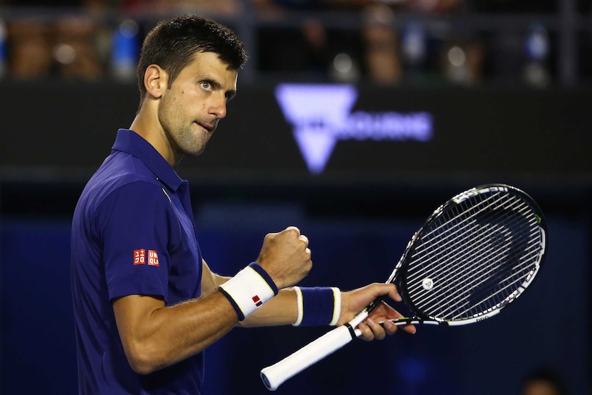 Clash of the titans ... Novak Djokovic celebrates winning a point in his semi-final match against Roger Federer