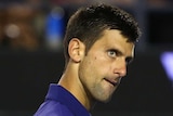 Serbia's Novak Djokovic celebrates point won against Roger Federer in Australian Open semi-final.