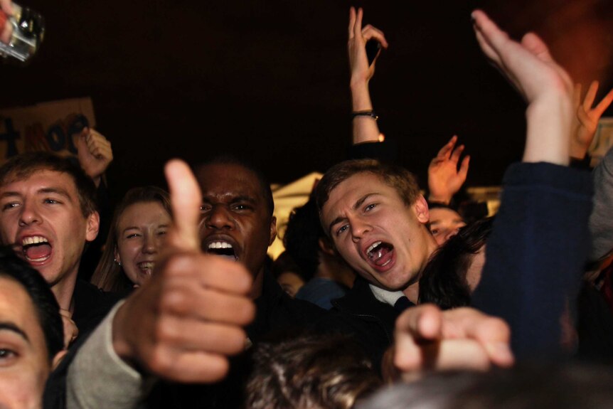 Supporters of US president Barack Obama celebrate the news of his victory in the 2012 presidential election outside the
