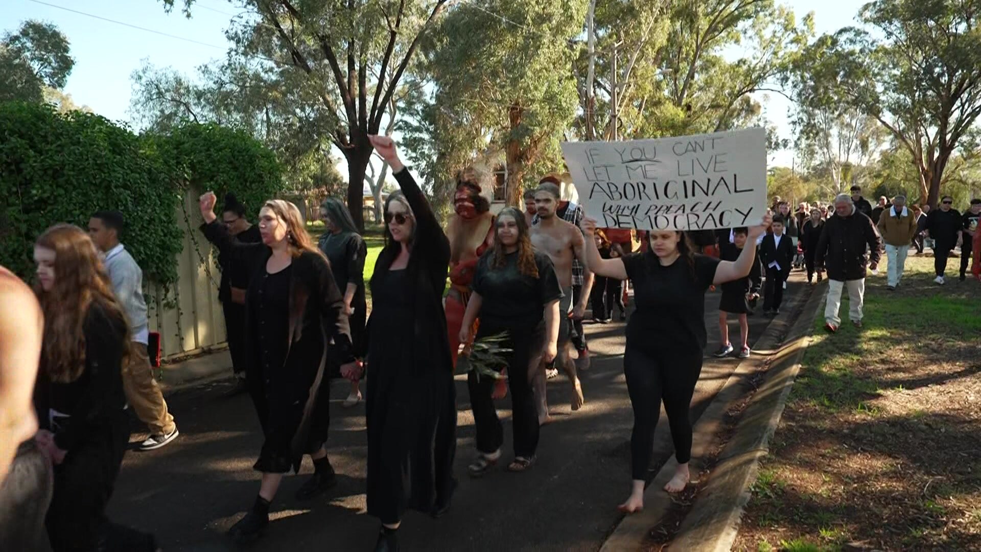 People marching with banners.