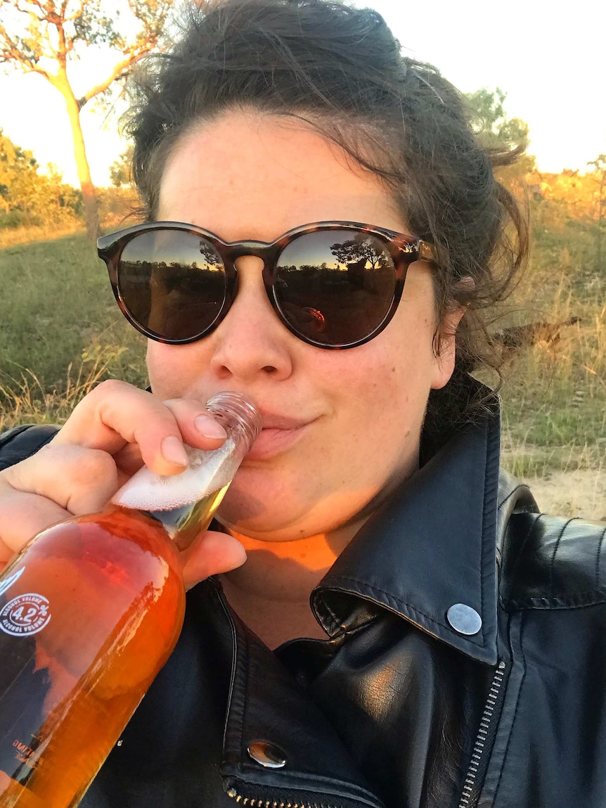 Bernadette "Bernie" Cantrall enjoys a beer, something she loves to do with friends
