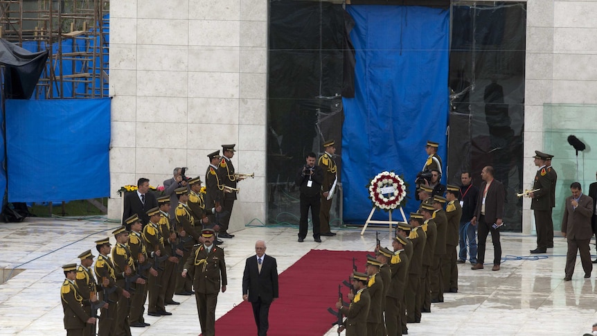 An honour guard in position at the grave of Yasser Arafat.