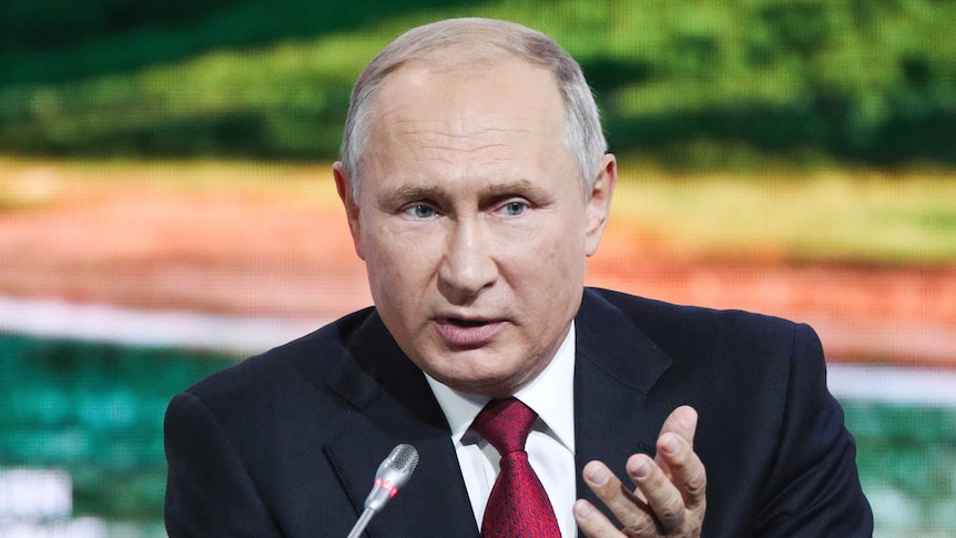 Russian President Vladimir Putin gestures as he addresses at the Eastern Economic Forum
