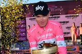 Britain's Chris Froome poses with the Giro d'Italia trophy in Rome on May 27, 2018.