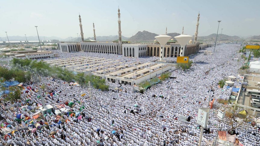 Muslim pilgrims perform the noon prayer
