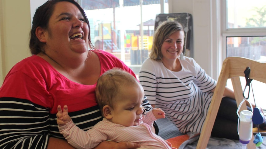 Casey Clever, her daughter Arcadia and paediatric nurse Gemma Sweaney at the Stella Bella Childcare Centre.