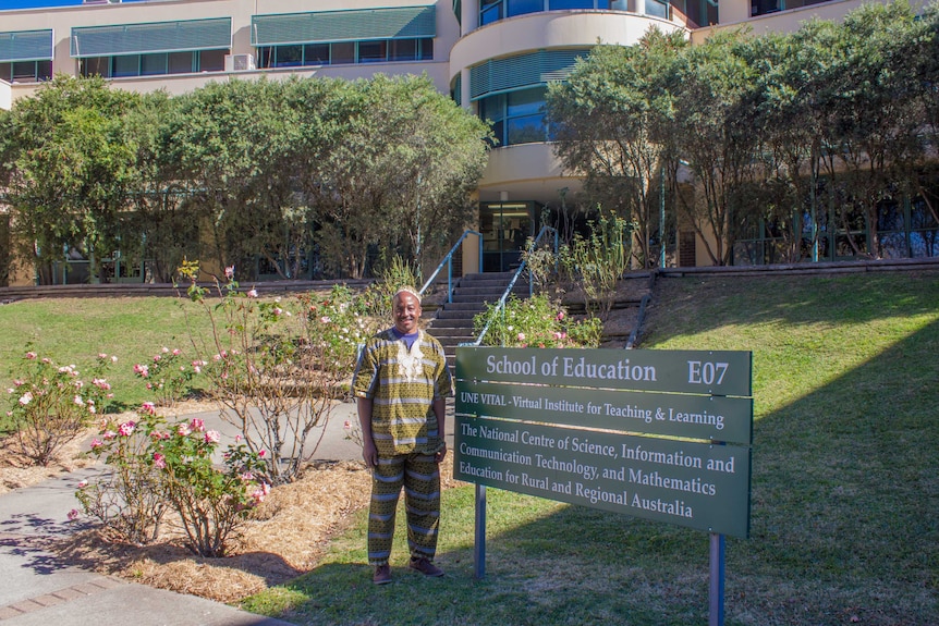 Mutuota Kigotho outside School of Education at UNE