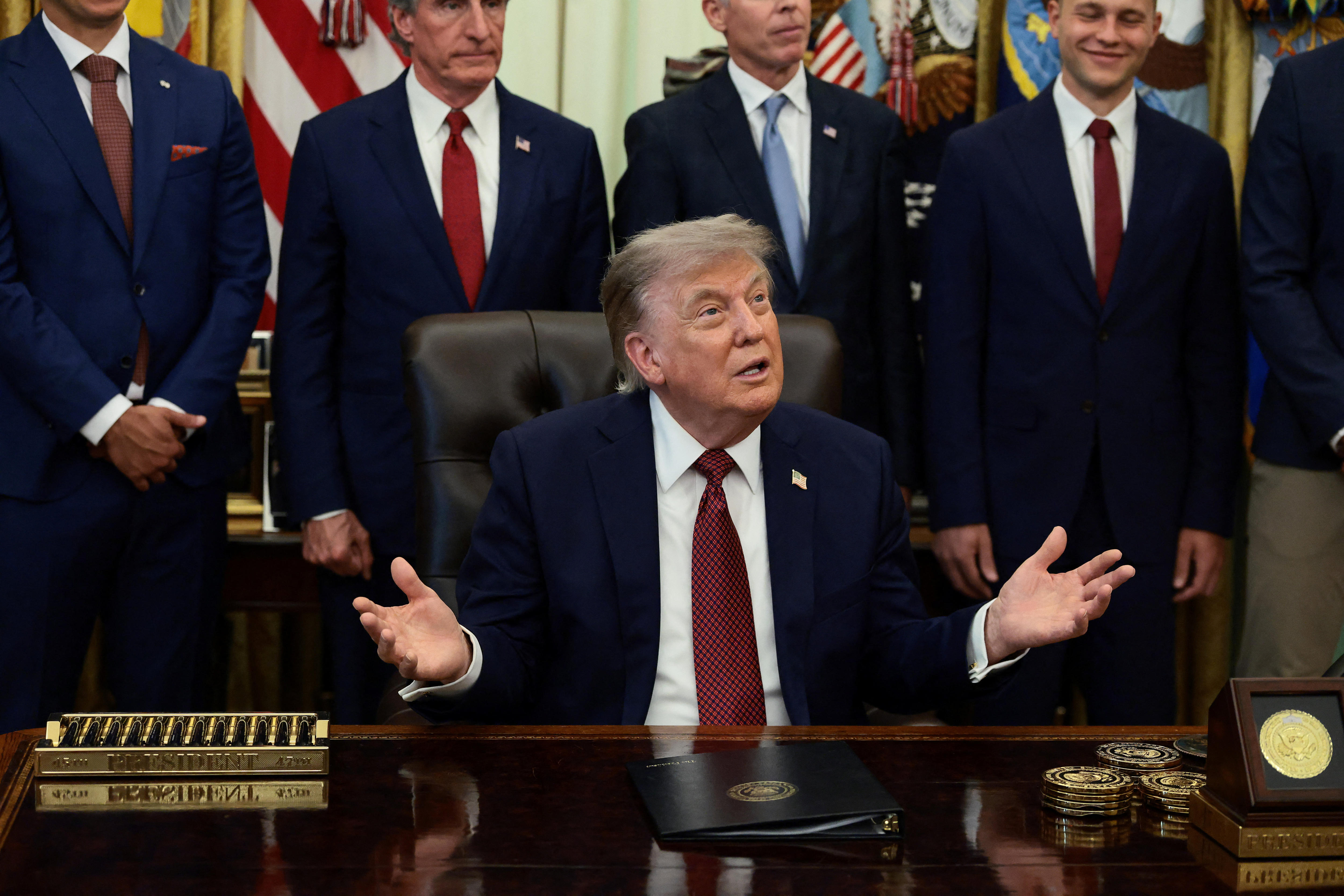Businesses sue Trump as he defends 'very standard tariffs'