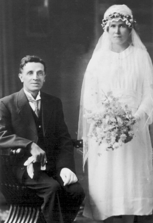 A black and white photo of a bride and groom.