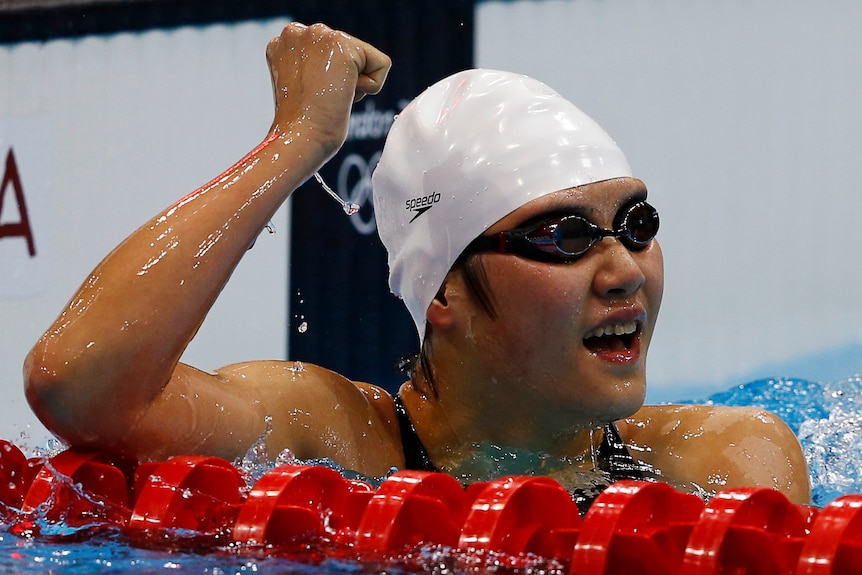 China's Ye Shiwen celebrates winning gold in the women's 400m individual medley final