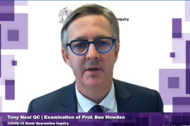 Professor Ben Howden, with blue round glasses, gives evidence via Zoom.
