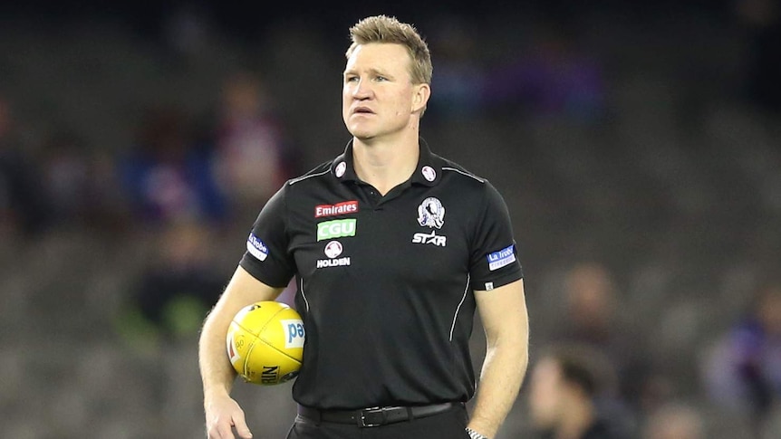 Collingwood coach Nathan Buckley on the field before