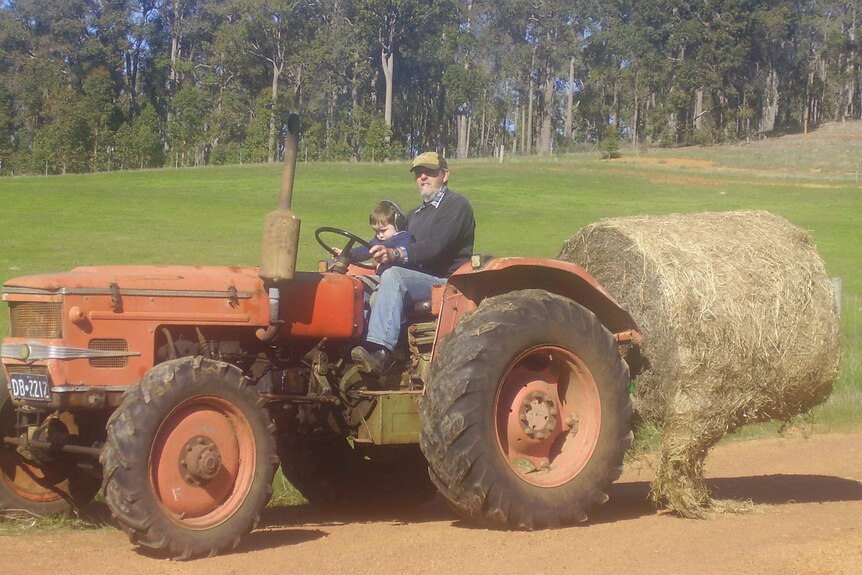 Gary Elks uses his tractor on a property in Western Australia.