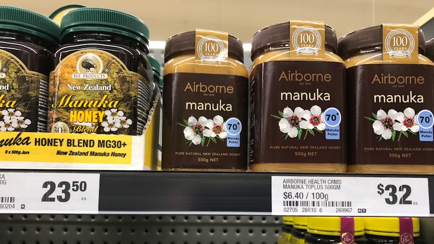 jars of Manuka honey on a supermarket shelf  with price tag included