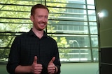 Comedian and actor Luke McGregor gives two thumbs up