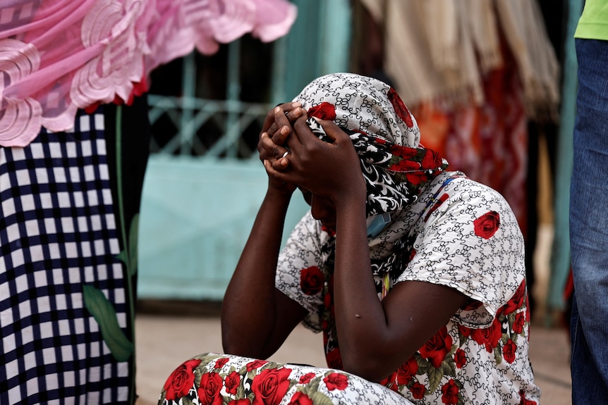 A mother reacts to the death of her 10-day-old baby