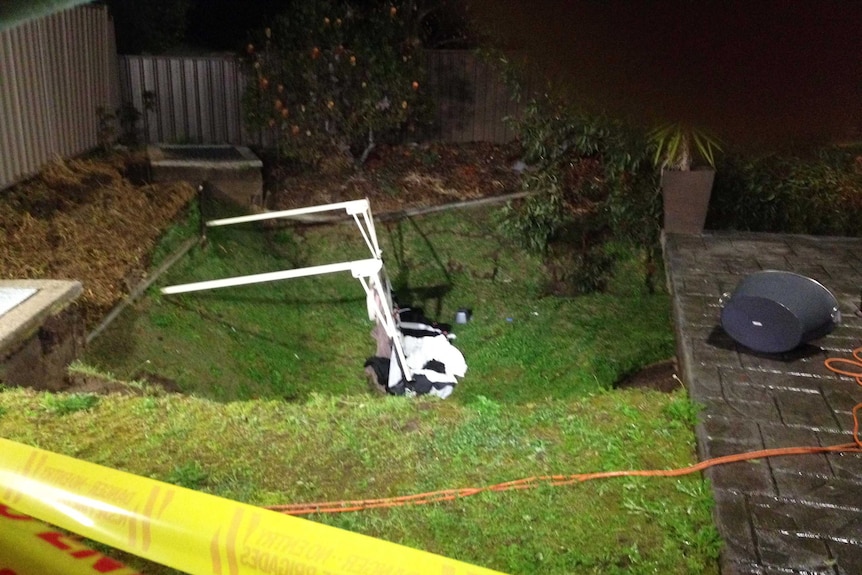 Sinkhole opens up in backyard at Illawong