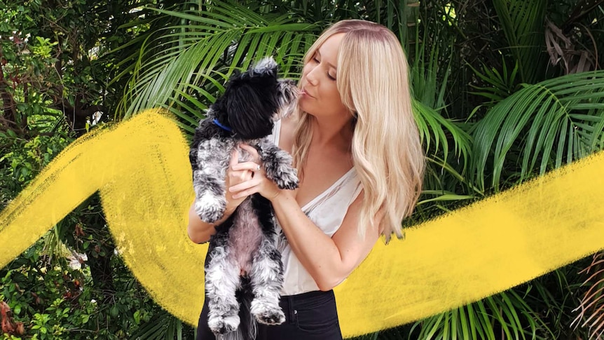 Kellie Scott holding dog Peppa
