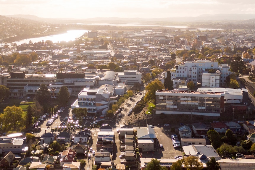 An aerial view of a city during sunset.