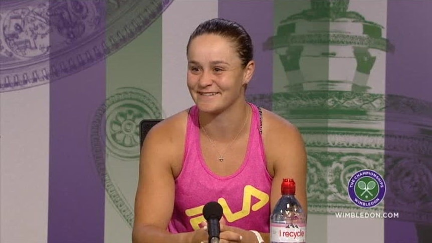 Ash Barty smiles during a press conference at Wimbledon.