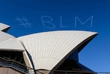 #BLM is written in skywriting over the Sydney Opera House.