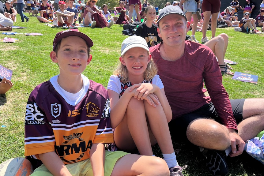 A family dressed in Broncos colours