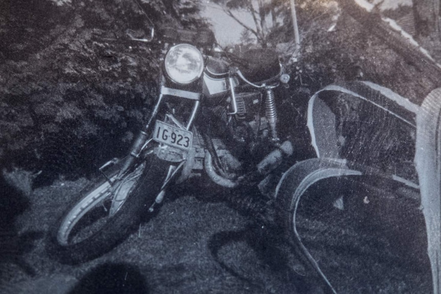 A black and white copy photograph of the Yamaha RD 250 cc motor bike with a bent front wheel.