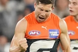 Toby Greene celebrates after kicking a goal for the Giants.