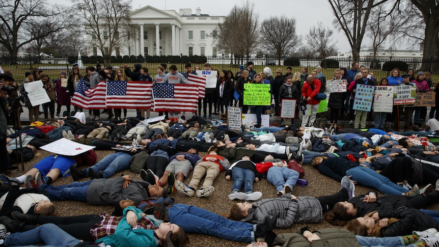 Students participate in a "lie-in" during a protest in favour of gun control reform in front of the White House. (Photo: AP/Evan Vucci)