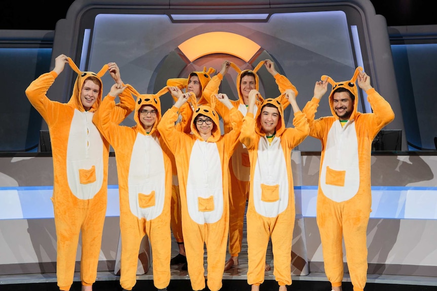 Australia's Overwatch World Cup team stands on stage in Kangaroo onesies