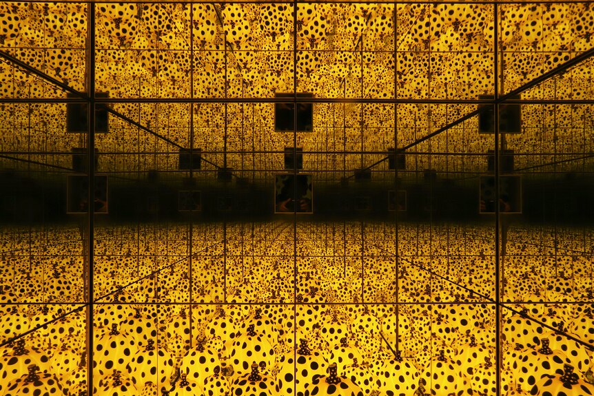 A mirror box endlessly reflecting pumpkins.