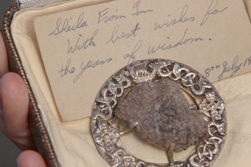 A piece of the Stone of Destiny in a brooch.