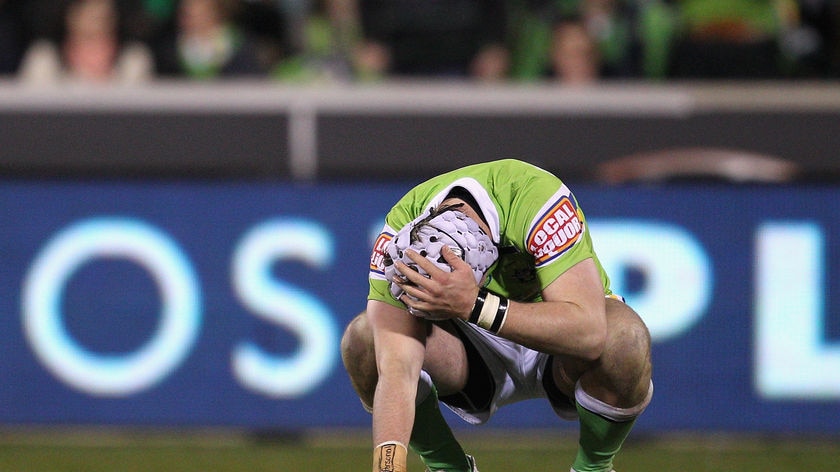 Painful exit: A shattered Jarrod Croker reflects on a late miss, when his penalty shot would have locked the scores.