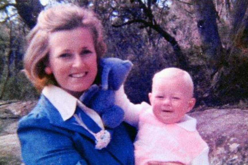 A photo from the 1980s of a blonde woman and baby