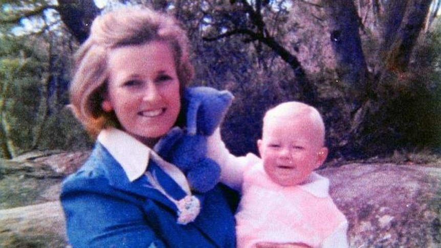 A photo from the 1980s of a blonde woman and baby