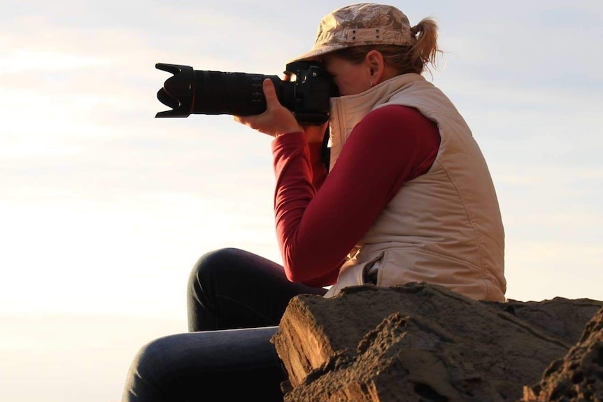 Woman taking photographs