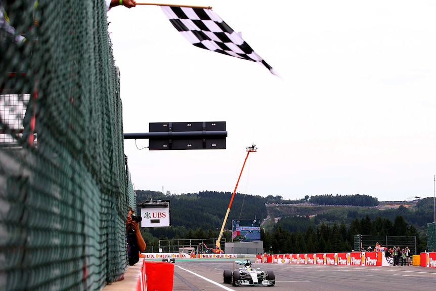 Lewis Hamilton crosses the finish line to win the 2015 Belgian F1 Grand Prix at Spa-Francorchamps.