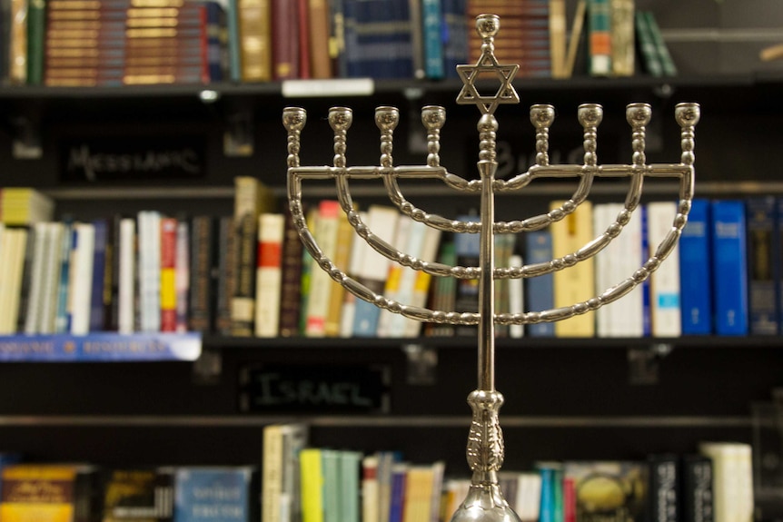 Menorah in front of bookshelf at Jews for Jesus store in Bondi Junction.