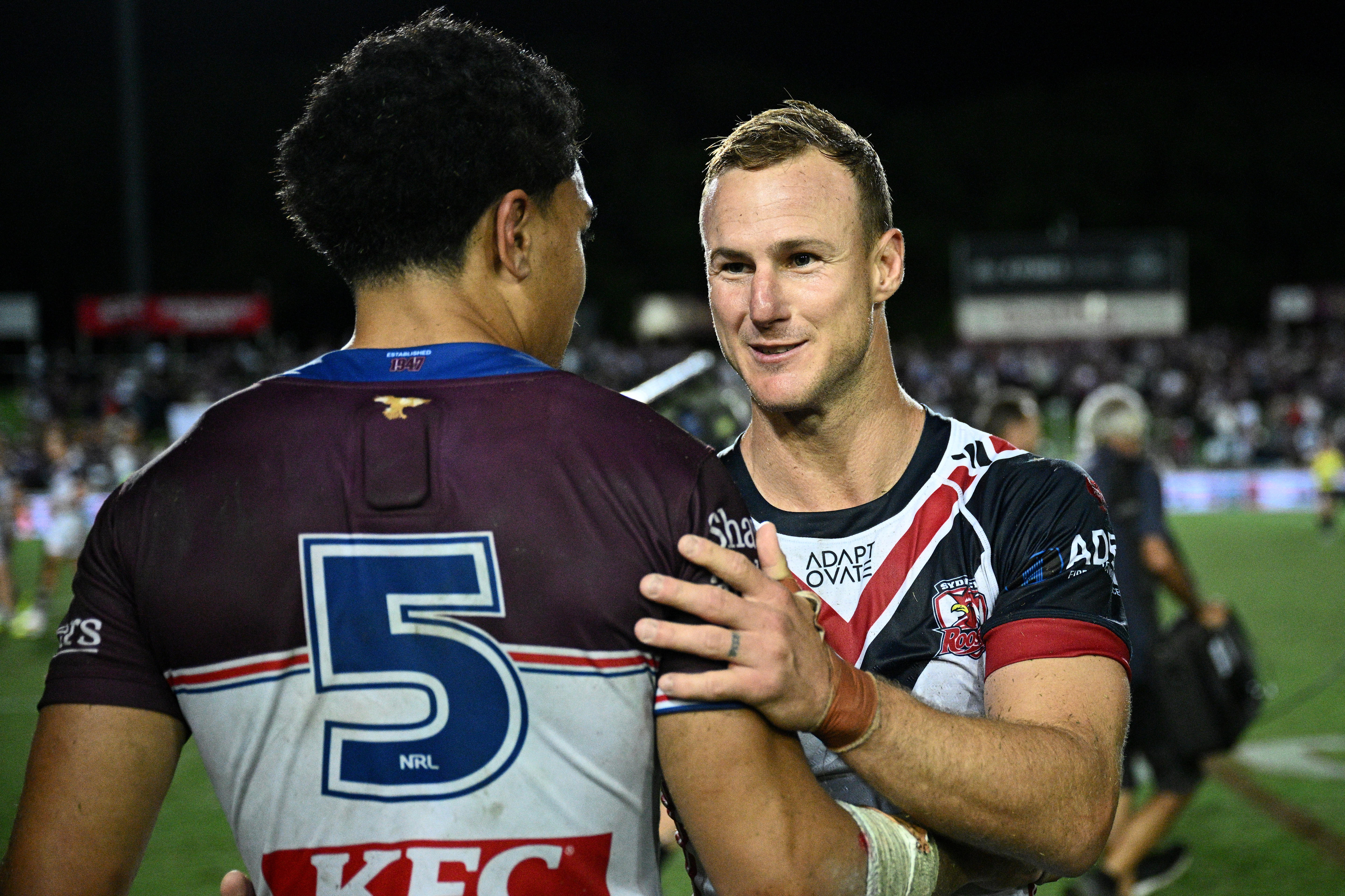 Daly Cherry-Evans shakes hands with a Manly player 