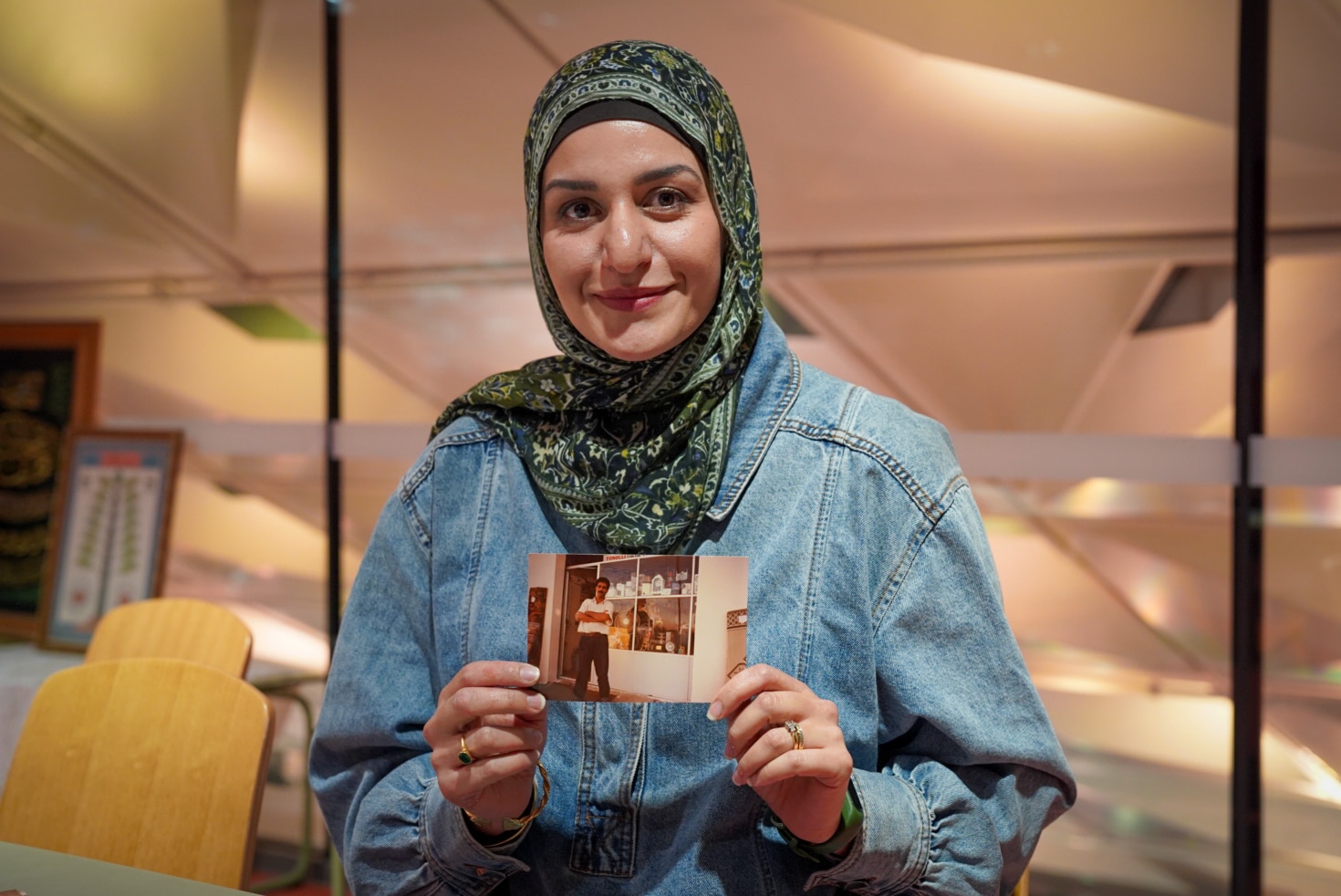 Amani Haydar hold a photo of uncle in the village of aitaroun