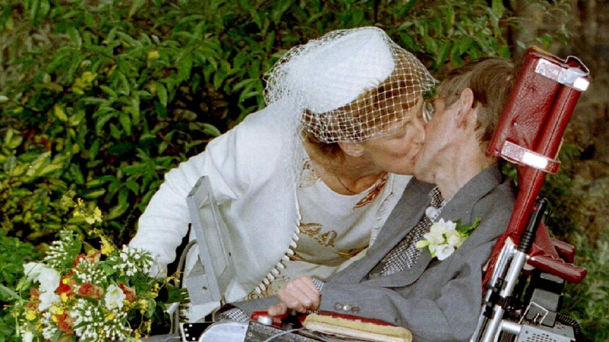 A kiss for scientist and theorist Stephen Hawking from his new bride Elaine Mason after their civil wedding in 1995.