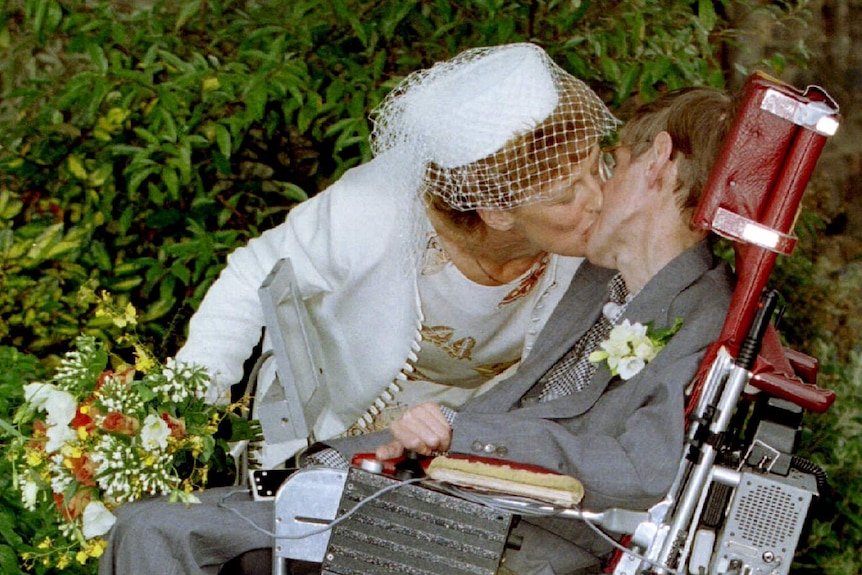 A kiss for scientist and theorist Stephen Hawking from his new bride Elaine Mason after their civil wedding in 1995.