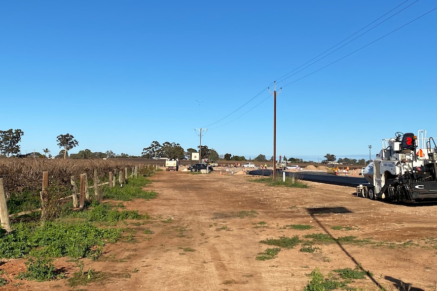 A block with large vehicles parked at the end.