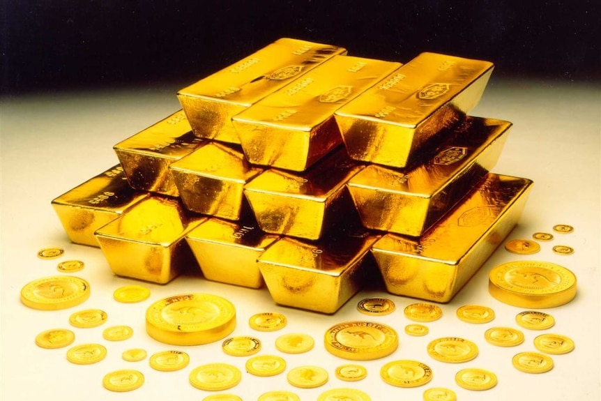 A bunch of gold bars and coins. 