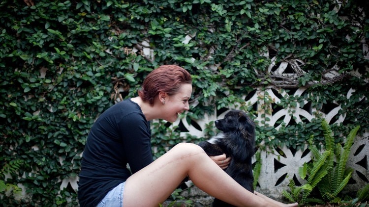 Cancer survivor Jasmine with her dog