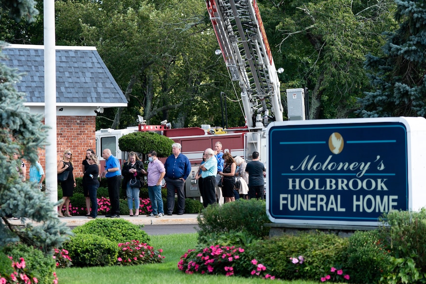 People wait in line for Gabby Petito's memorial service