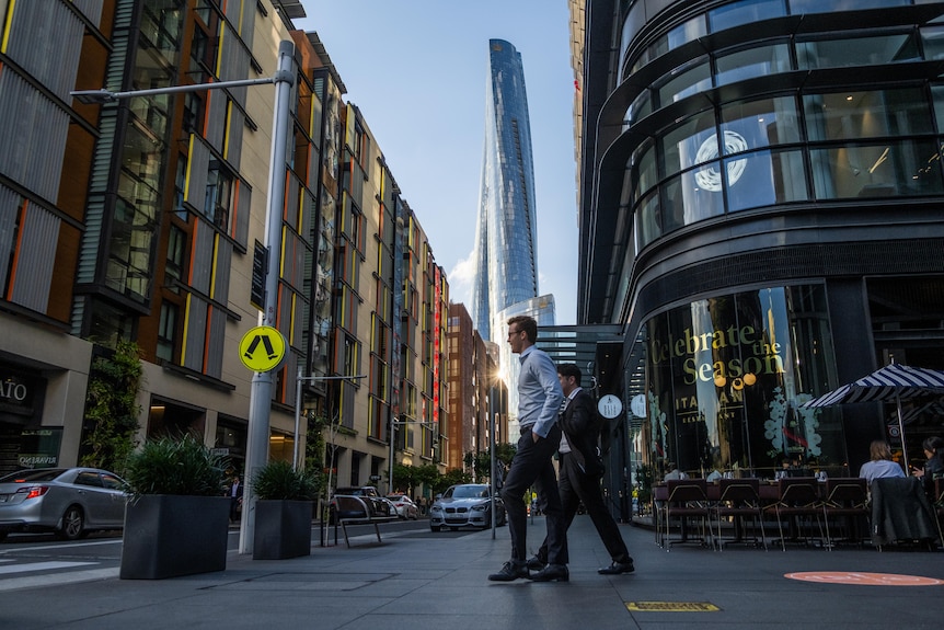 Pedestrians walk near Crown Sydney