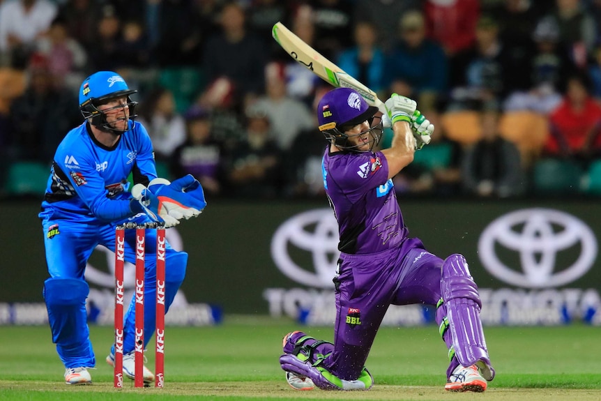 Tim Paine hits a six during the BBL