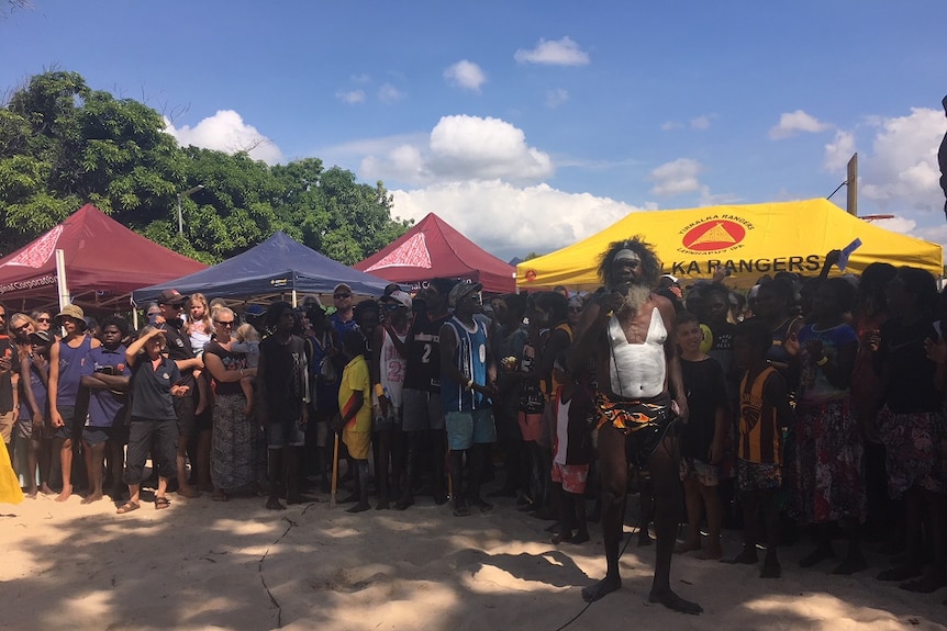 Witiyana Marika takes the mic to sing 'Treaty' at a commemoration ceremony to the late Dr M Yunupingu.